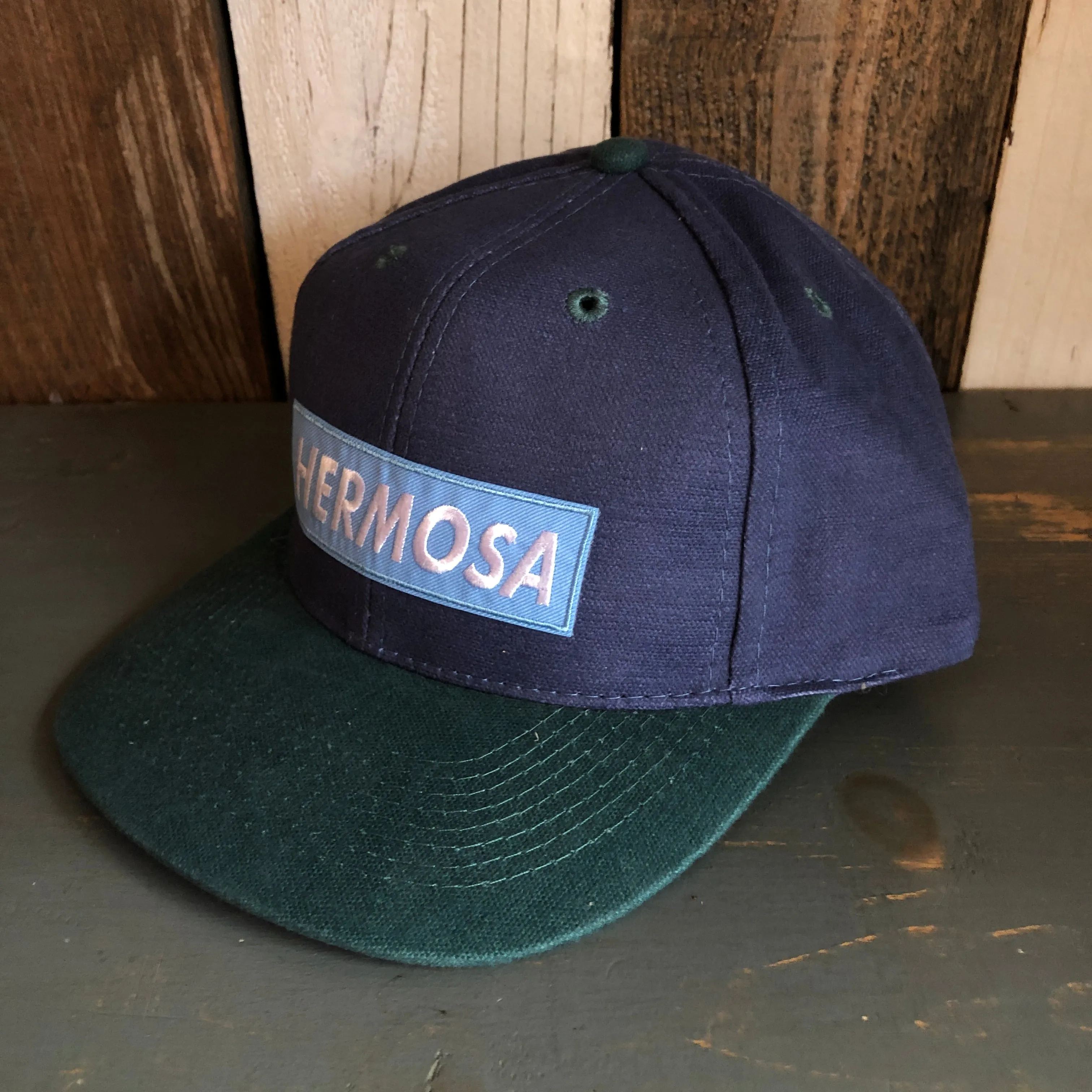 Hermosa Beach BLUE SUPREME HERMOSA - 6 Panel Low Profile Baseball Cap with Adjustable Strap with Press Buckle - Navy/Dark Green
