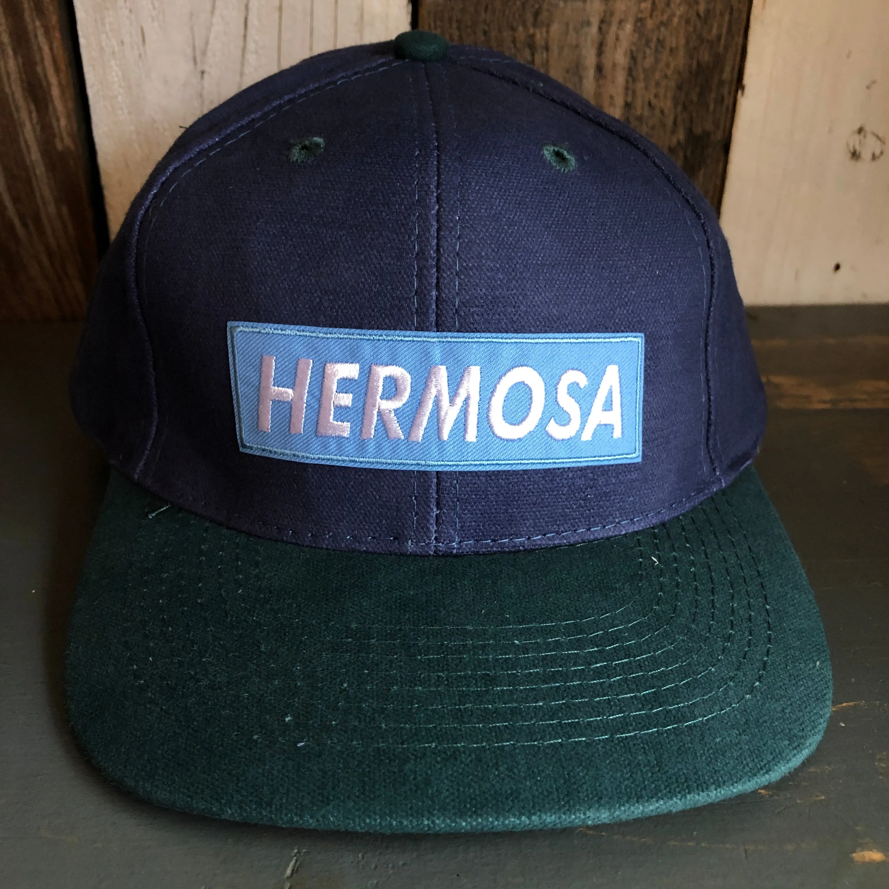 Hermosa Beach BLUE SUPREME HERMOSA - 6 Panel Low Profile Baseball Cap with Adjustable Strap with Press Buckle - Navy/Dark Green